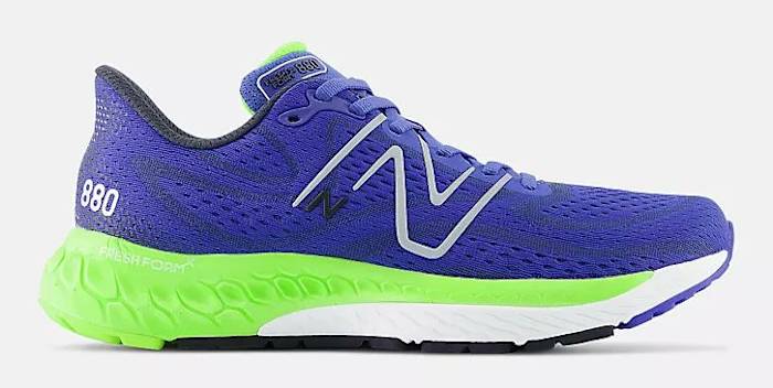 Side view of blue and green New Balance running shoe.